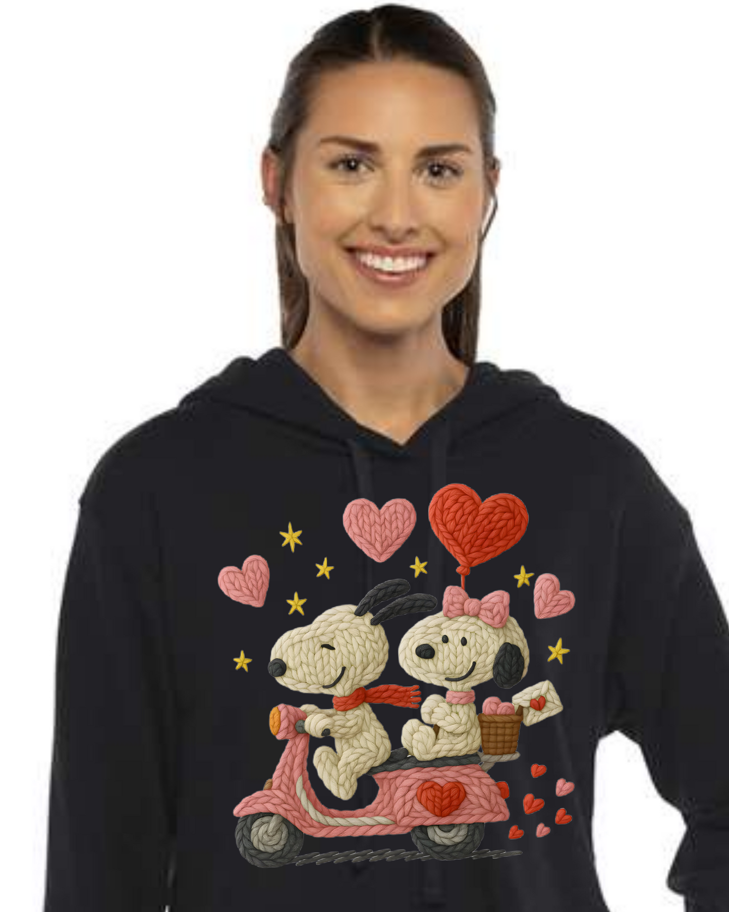 Woman wearing a black hoodie with cartoon characters and hearts on a white background